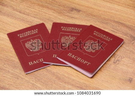 three international passports on a wooden background