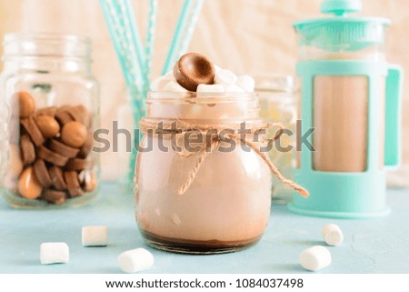 Hot cocoa with marshmallows. Delicious dessert shot in high key. The background in the bokeh. A gentle romantic photo.