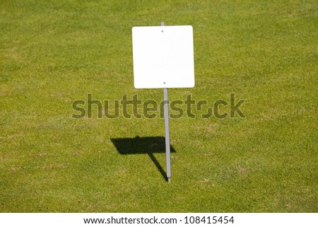 blank sign on the green field