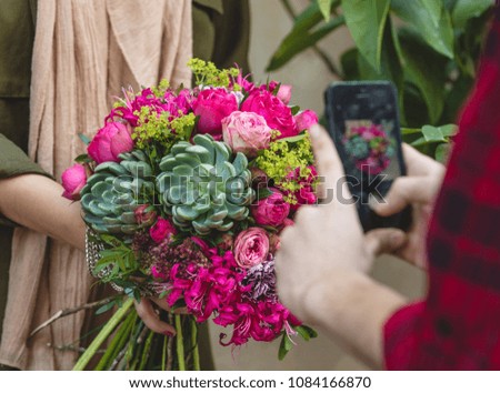 pink flower bunch decorated with green succulent roses