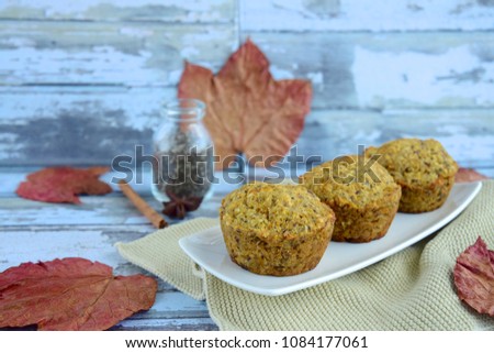 Gluten free pumpkin cinnamon chia seed muffins served with a cup of coffee
