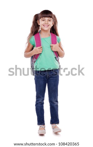 Full length portrait of a schoolgirl standing on white background