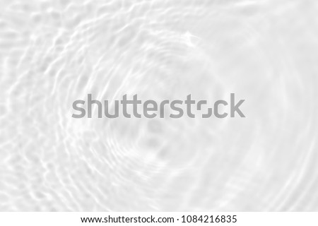 white wave abstract or rippled water texture background Royalty-Free Stock Photo #1084216835