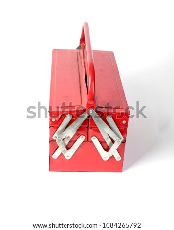old dirty red box with tools on white background isolated
