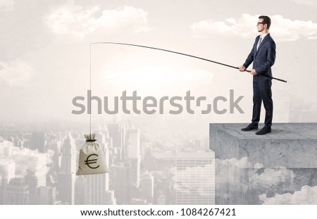 Businessman fishing sack of currency from the cityscape concept