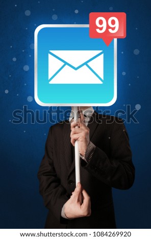 Smart businessman holding square sign with mail icon