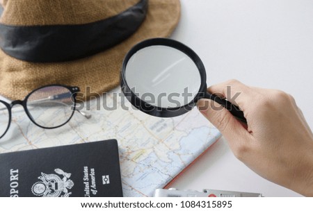 Travel concept set with copy space - Stock image
Map, World Map, Airplane, Camera - Photographic Equipment, Magnifying , passport,Glass,Woman hand holding a magnifying glass. closeup background