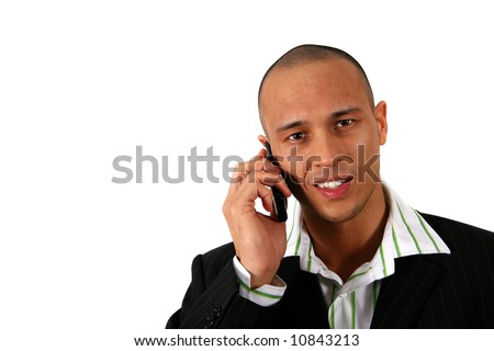 At Work Stylish young man in suit is using his cell phone. Isolated over white.
