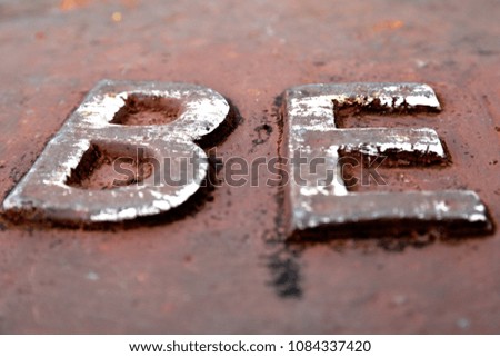 Metal letters B and E