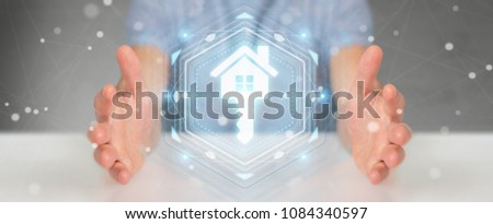 Businessman on blurred background using real estate digital interface 3D rendering