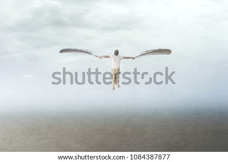 man with plumes wings fly in the sky Royalty-Free Stock Photo #1084387877