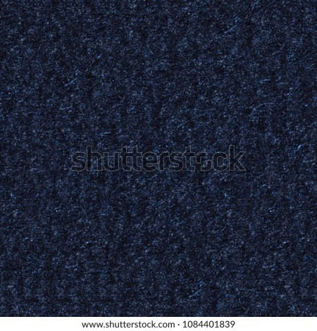 Dark blue paper texture with reliefs on surface. Seamless square background, tile ready. High resolution photo.