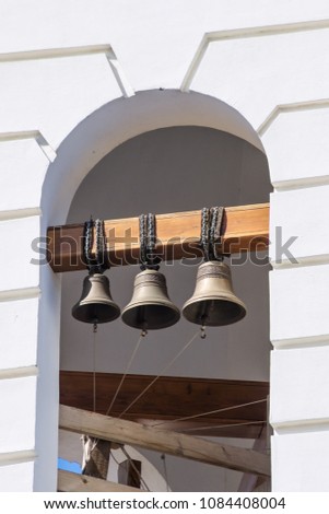 Bronze bells on the bell tower of the Orthodox Church. The picture was taken in Russia, in the city of Orenburg. 04/17/2018