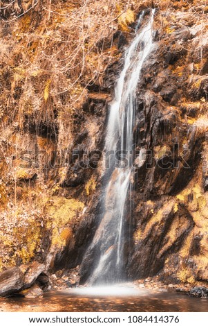 waterfall in autumn season near the little village of Roggiano - Italy