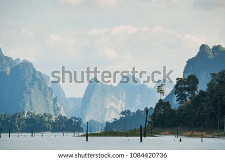 Landscape of the dam and lake on the mountain with tree and forest with beautiful blue sky and clouds on sunshine day.