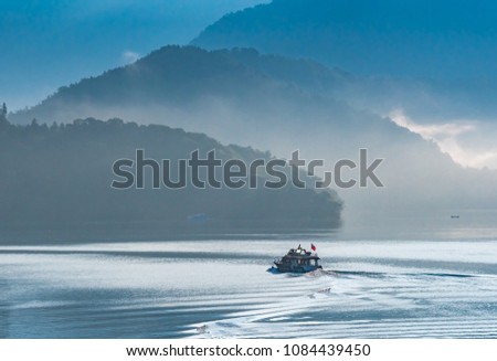 Beautiful Background in the morning with Clouds, Sunlight and sky reflect in the lake at Sun Moon Lake. Taiwan, Blue and Cool Tone Photography.