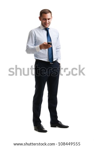Young and successful businessman is reading a message on his smartphone Royalty-Free Stock Photo #108449555