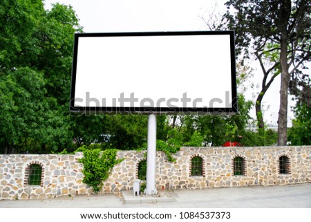Large blank billboard located on the side of the road.