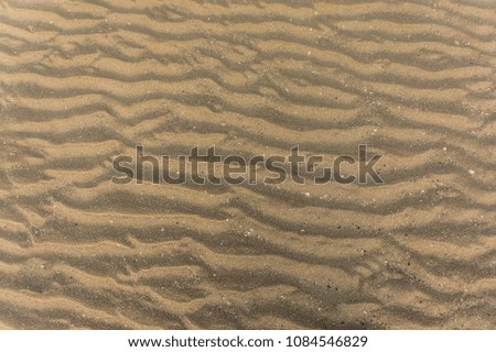Wave texture of sand beach for background