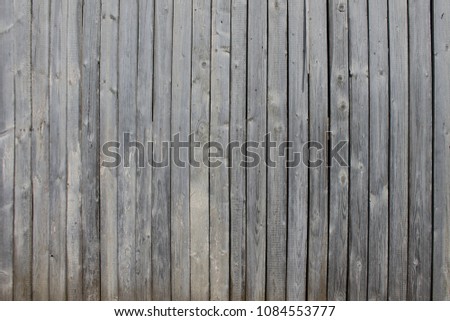 Texture of wooden boards in gray. Background of vertical planks.