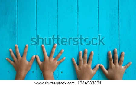 Children's finger band lined up on a blue background.