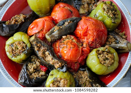 Classical Azerbaijani dolma with eggplant, tomato and pepper (Summer or three sisters dolma)  Royalty-Free Stock Photo #1084598282