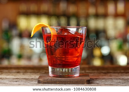 Classic cocktail Negroni with gin, campari and martini rosso. Traditional recipe. Place for writing text
 Royalty-Free Stock Photo #1084630808