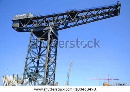 Traditional cranes on the landmark quayside of River Clyde in Glasgow, Scotland