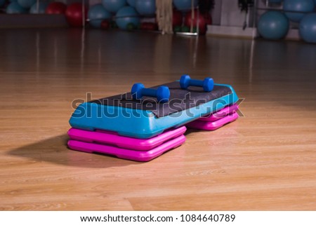Step platform in gym, equipment for effective exercises