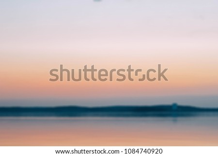 
blurred background of the sea and sunset.