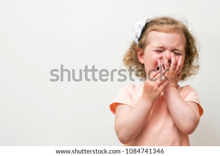 Baby Girl crying over white background