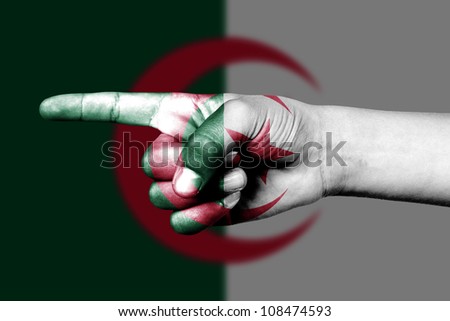 man hand point with finger in algerian national flag