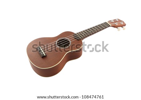 Small guitar (ukulele) from body on white background.