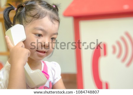 Children is calling telephone.Communication concept.