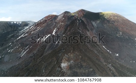 Aerial picture of Mount Etna peak is an active stratovolcano on east coast of Sicily Italy in the Metropolitan City of Catania and is the highest active volcano in Europe outside the Caucasus