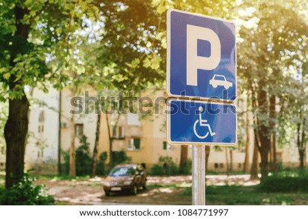 Handicap parking spot sign, reserved lot space for disabled person, selective focus