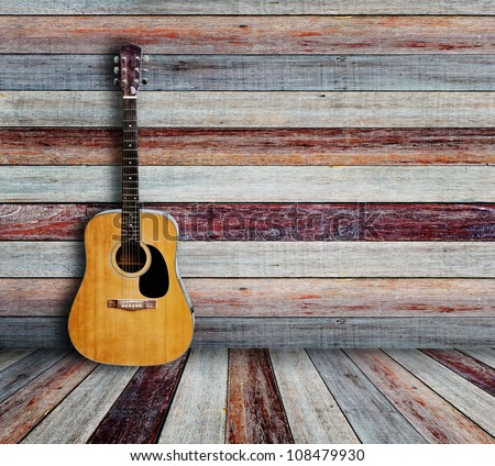 Guitar in vintage wood room. Royalty-Free Stock Photo #108479930