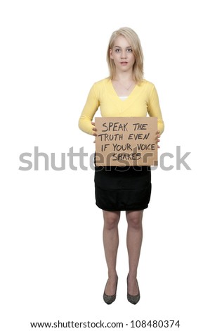 A beautiful young woman holding up an inspirational sign