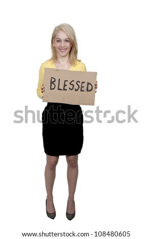 Beautiful young woman holding up a sign that says Blessed