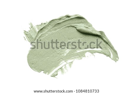 Cosmetic mud mask smear isolated on white background. Top view, closeup texture of blue facial clay, copy space Royalty-Free Stock Photo #1084810733