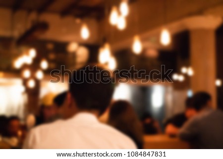 Abstract blur bar and brewery with full drinkers. interior for background.