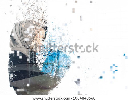 Young businesswoman dispersing into pixels for business spirit concept