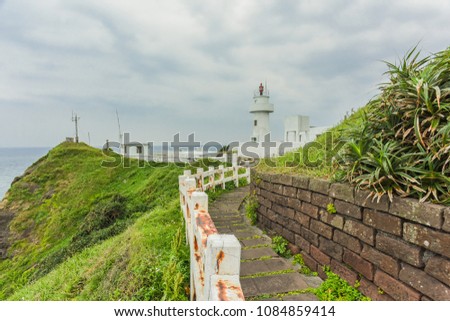 Landscape View of A Beautiful White Lighthouse (Bitou Lighthouse) at The Northeast Coast of Taiwan, New Taipei City, Taiwan