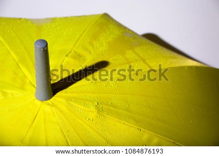 Yellow umbrella on white background.