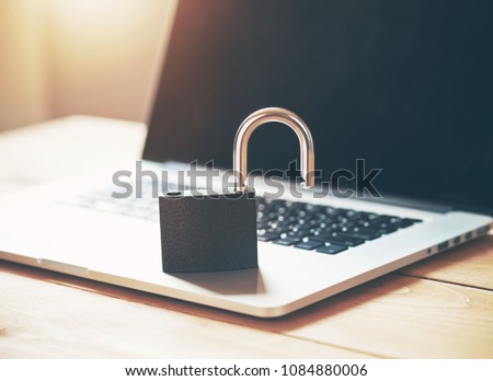 Lock on laptop as computer protection and cyber safety concept. Private data protection from hacker malware