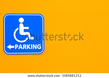 handicapped sign parking on the wall.