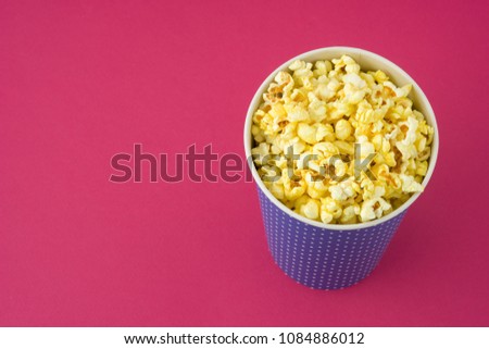 Popcorn in a pack on a red background