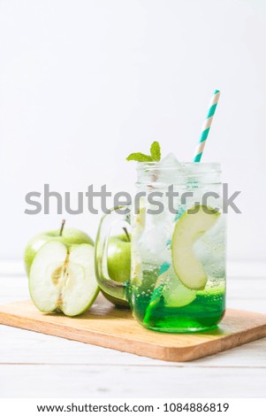 green apple soda on wood table