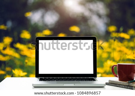 Empty space,desk white with on Laptop computer with blank screen and coffee cup at blurred background nature of light bokeh.