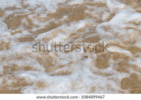 Stream wave with bubble on the beach, Tropical sea wave.